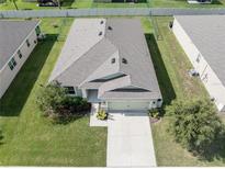 Birds-eye view of the home's roof, landscaping, and proximity to neighboring properties at 6138 Sw 89Th Lane Rd, Ocala, FL 34476