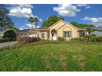 Charming single-Gathering home featuring a well-maintained lawn and lush landscaping at 11645 Sw 75Th Cir, Ocala, FL 34476