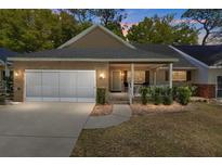 Charming single-story home with brick accents, a two-car garage, and a welcoming front porch at 8683 Sw 93Rd Ln # D, Ocala, FL 34481