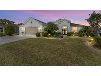 Charming single-story home with manicured lawn and a welcoming front entrance at 9290 Se 120Th Loop, Summerfield, FL 34491