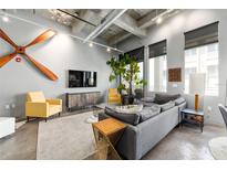 Bright, open living room featuring unique décor, comfortable seating, and large windows at 302 Se Broadway St # 330, Ocala, FL 34471