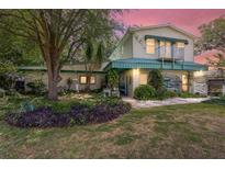 Charming two-story home with landscaped front yard and balcony at 31 Se Chinica Dr, Summerfield, FL 34491