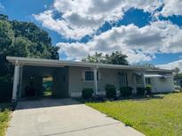 Charming single-story home with a covered carport and well-maintained landscaping at 10081 Sw 93Rd Ave, Ocala, FL 34481
