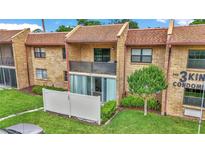 Charming condo with brick facade, balcony and a well-manicured lawn at The 3 Kings Condominiums at 2837 Ne 3Rd St # 103, Ocala, FL 34470