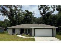 Charming one story home with a well maintained lawn and covered entryway at 11165 Nw 7Th St, Ocala, FL 34482