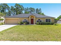 Charming one-story home with a well-manicured lawn and mature trees at 3011 Se 46Th Ave, Ocala, FL 34480