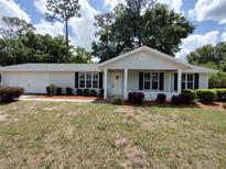 Charming single-story home with mature trees and attractive landscaping at 8045 Sw 108Th Loop, Ocala, FL 34481