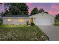 Charming single-story home boasts a well-maintained lawn and inviting curb appeal at 11153 Sw 79Th Ave, Ocala, FL 34476