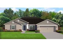 Charming single-story home with a beautifully landscaped yard and a welcoming two-car garage at 8468 Sw 59Th Ter, Ocala, FL 34476