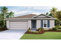 Charming single-Gathering home featuring a two-car garage, manicured lawn, and a welcoming front entrance at 13032 Sw 84Th Terrace Rd, Ocala, FL 34473