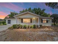Charming single-story home with tidy landscaping and a welcoming covered front porch at 8371 Sw 109Th St, Ocala, FL 34481