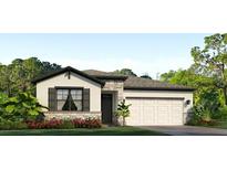 Beautiful single-story home with stone accents, a two-car garage, and well-maintained landscaping at 4050 Nw 48Th Terrace Rd, Ocala, FL 34482
