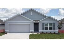 Charming single-story home features a two-car garage, well-maintained lawn, and stylish gray exterior at 4691 Sw 88Th Ln, Ocala, FL 34476