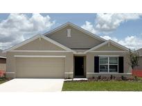 Charming single-story home with a two-car garage, neutral color palette and well-maintained lawn at 4707 Sw 88Th Ln, Ocala, FL 34476