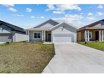 Charming single-story home features a two-car garage, well-manicured lawn, and a welcoming front entrance at 4778 Se 25Th Loop, Ocala, FL 34480