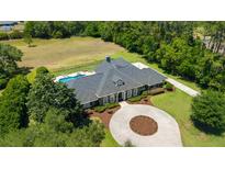Aerial view of home with large lot and pool at 5484 Sw 30Th Ave, Ocala, FL 34471
