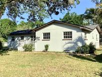 Charming single-story home featuring a cozy front porch and well-maintained landscaping in a serene neighborhood at 2138 Sw 9Th Rd, Ocala, FL 34471