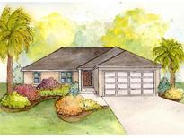 Charming single-story home with a well-manicured lawn, complemented by lush tropical landscaping and a two-car garage at 378 Sequoia Dr, Ocklawaha, FL 32179