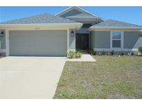 Charming single-story home featuring a well-manicured lawn and a two-car garage at 4373 Ne 31St St, Ocala, FL 34470