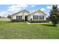 Charming single-story home with blue shutters and manicured landscaping at 4721 Se 36Th St, Ocala, FL 34480