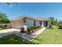 Well-maintained exterior showcasing a lovely home with a manicured lawn at 7249 Sw 93Rd Ave, Ocala, FL 34481