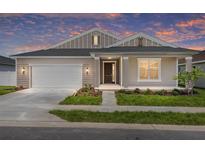 Charming single-story home featuring a two-car garage and a well-manicured lawn at 7827 Sw 56Th Pl, Ocala, FL 34474