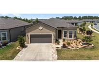 Charming single-story home with well-manicured landscaping and a two-car garage at 9063 Sw 59Th Lane Rd, Ocala, FL 34481