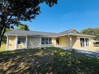 Charming single-story home with a manicured lawn and a freshly painted exterior at 3 Pine Radial Ln, Ocala, FL 34472