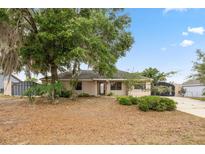Charming single-story home with mature landscaping and a welcoming front entrance at 1114 Hickory Rd, Ocala, FL 34472