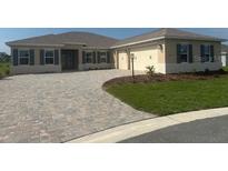 Charming single-Gathering home with a well-manicured lawn and a spacious two-car garage at 10530 Sw 98Th Pl, Ocala, FL 34481