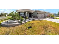 Charming single-story home with manicured landscaping and a two-car garage, creating great curb appeal at 8998 Sw 75Th Loop, Ocala, FL 34481