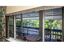 Enjoy the views of the water from this balcony overlooking the water and mature trees and lush vegetation at 20820 River Dr # B32, Dunnellon, FL 34431