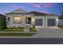 Charming single-story home featuring a welcoming front porch and two-car garage at 6342 Sw 77Th Ave, Ocala, FL 34474