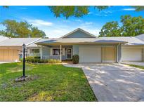 Charming single-story home featuring an attached two-car garage and well-maintained lawn at 8569 Sw 92Nd Ln # D, Ocala, FL 34481