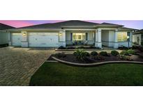 Charming single-story home with a well-manicured front yard and two-car garage at 8457 Sw 97Th Cir, Ocala, FL 34481