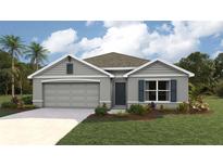 Charming single-story home featuring a two-car garage, well-manicured lawn, and tropical landscaping at 7101 Se 113Th Ln, Belleview, FL 34420