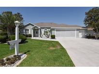 Charming single-story home with well-manicured lawn, mature trees and a spacious two car garage at 2550 Nw 55Th Avenue Rd, Ocala, FL 34482