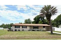 Charming single-story home with a well-maintained front yard and mature palm tree at 2848 Se 11Th St, Ocala, FL 34471