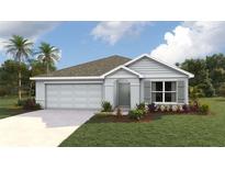 Charming single-story home featuring a two-car garage and a well-manicured lawn at 4235 Sw 53Rd Lane Rd, Ocala, FL 34474