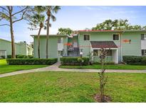 Charming two-story condo in a lush green community, featuring well-maintained landscaping and ample parking at 546 Midway Dr # B, Ocala, FL 34472