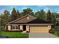 Charming single-story home with a two-car garage, landscaped front yard, and classic design elements at 15833 Se 97Th Ter, Summerfield, FL 34491