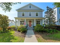 Charming two-story home with covered front porch and landscaped yard at 1906 Se 28Th Pl, Ocala, FL 34471