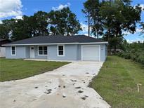 Charming single-story home with a well-maintained lawn and a one-car garage, all in a peaceful neighborhood at 5787 Nw 58Th Ter, Ocala, FL 34482