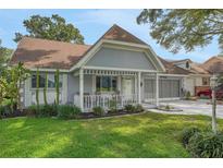 Charming single-story home featuring a welcoming front porch, attached garage, and well-maintained landscaping at 8784 Sw 93Rd Ln # A, Ocala, FL 34481