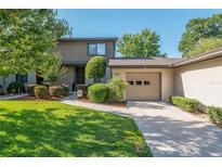 Charming townhome featuring well-maintained landscaping, an attached garage and a cozy front porch at 3815 Ne 17Th Street Cir, Ocala, FL 34470