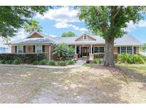 Charming single-story home with lush landscaping and mature trees in a serene setting at 5437 Se 34Th St, Ocala, FL 34480