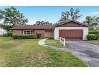 Charming single-story home with brick accents, well-maintained landscaping and two-car garage at 2146 Ne 9Th St, Ocala, FL 34470