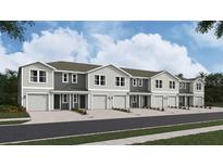 New townhomes with attached garages and neutral gray and white color scheme at 6567 Sw 81St Loop, Ocala, FL 34476