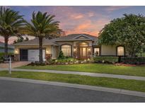 Charming home with a well-manicured lawn, stone accents, and a warm, inviting entrance at 4360 Sw 62Nd Loop, Ocala, FL 34474