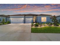 Charming single-story home with a two-car garage, landscaped front yard, and inviting entrance at 6046 Sw 86Th Cir, Ocala, FL 34481